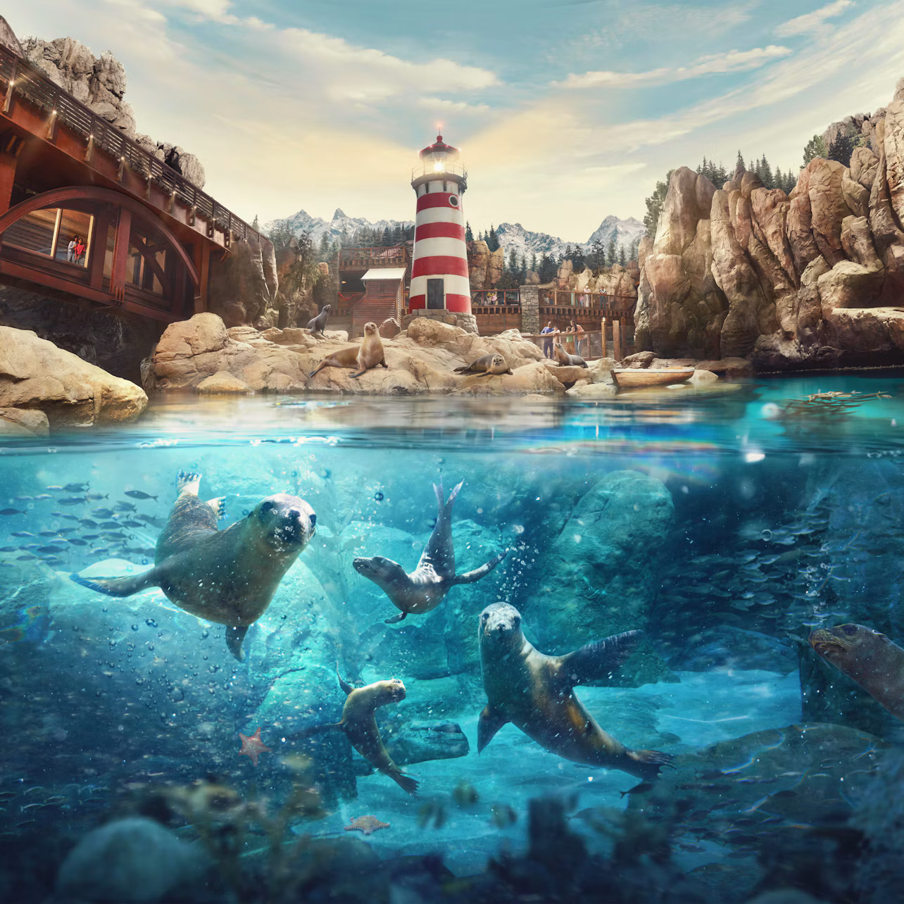 Seals swimming underwater in front of a shoreline with a red-and-white striped lighthouse, rocky cliffs, and a wooden bridge.