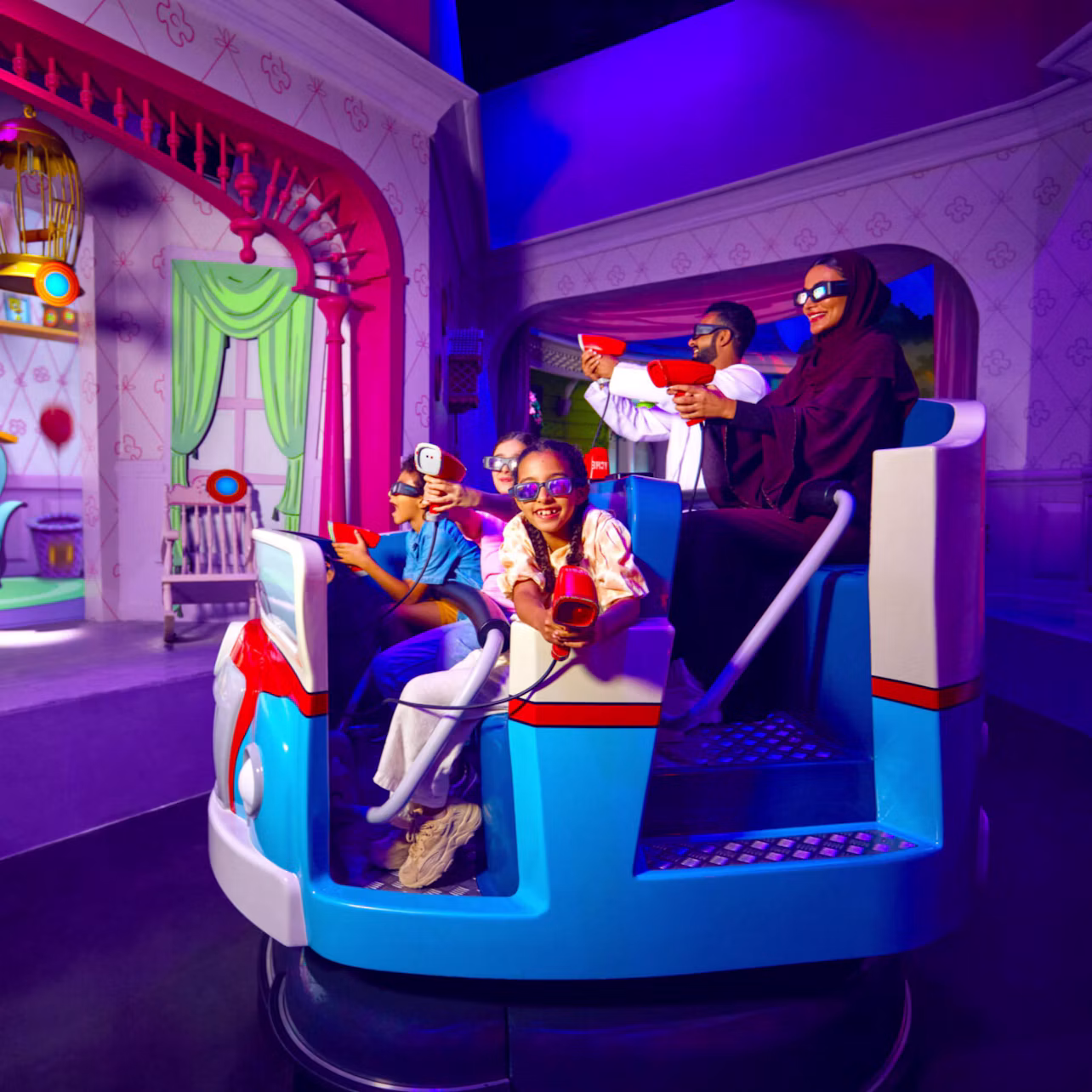 A group of people wearing 3D glasses playing a shooting game while seated in a themed ride vehicle in a colorful setting.