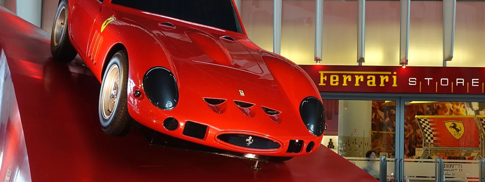 Ferrari World Abu Dhabi entrance on Yas Island, part of a four-park visitor comparison