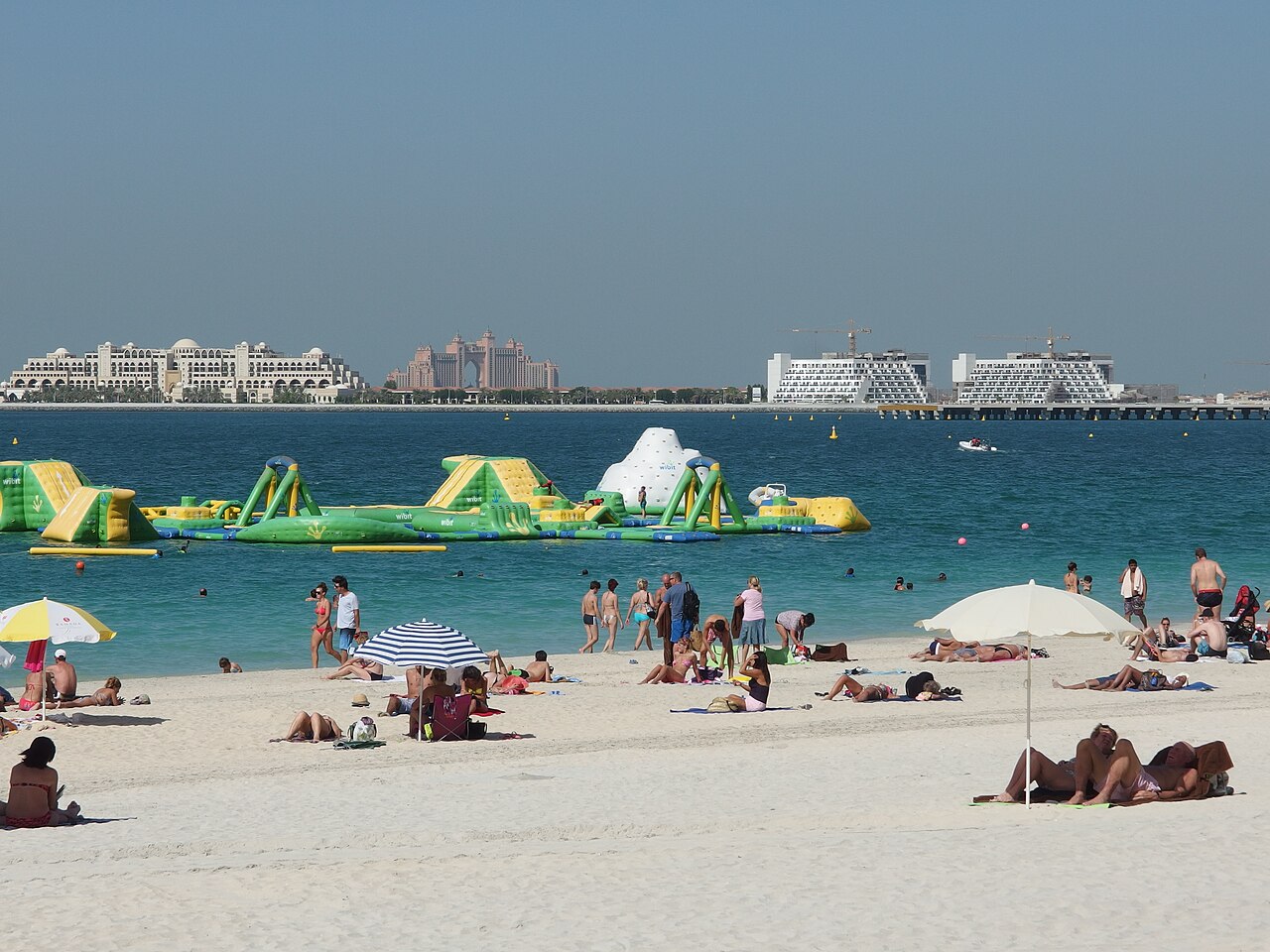 JBR beach and the surrounding Dubai Marina coastline, illustrating an urban beach day