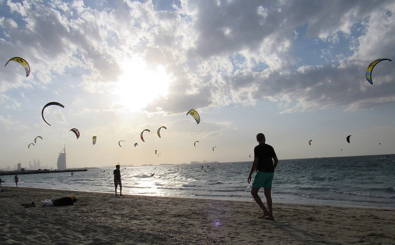 Kitesurfing sails above Kite Beach in the Jumeirah area of Dubai