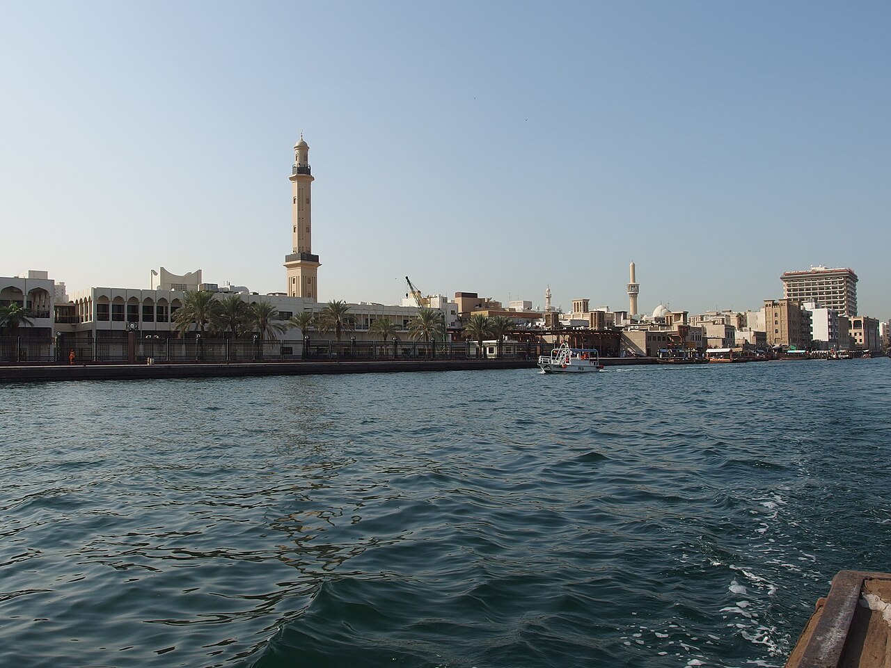 Traditional abra boats crossing Dubai Creek in the historic area of Dubai